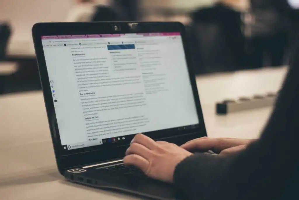 Man typing on a laptop