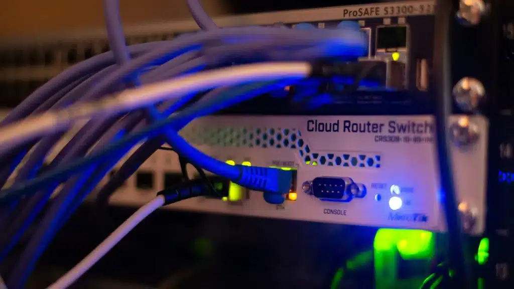 Photo of the back of a router with wires and lights