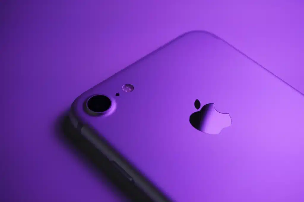 Purple Apple iPhone on purple backdrop