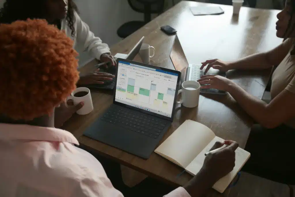 Woman at a meeting with Microsoft productivity tool on Microsoft Surface